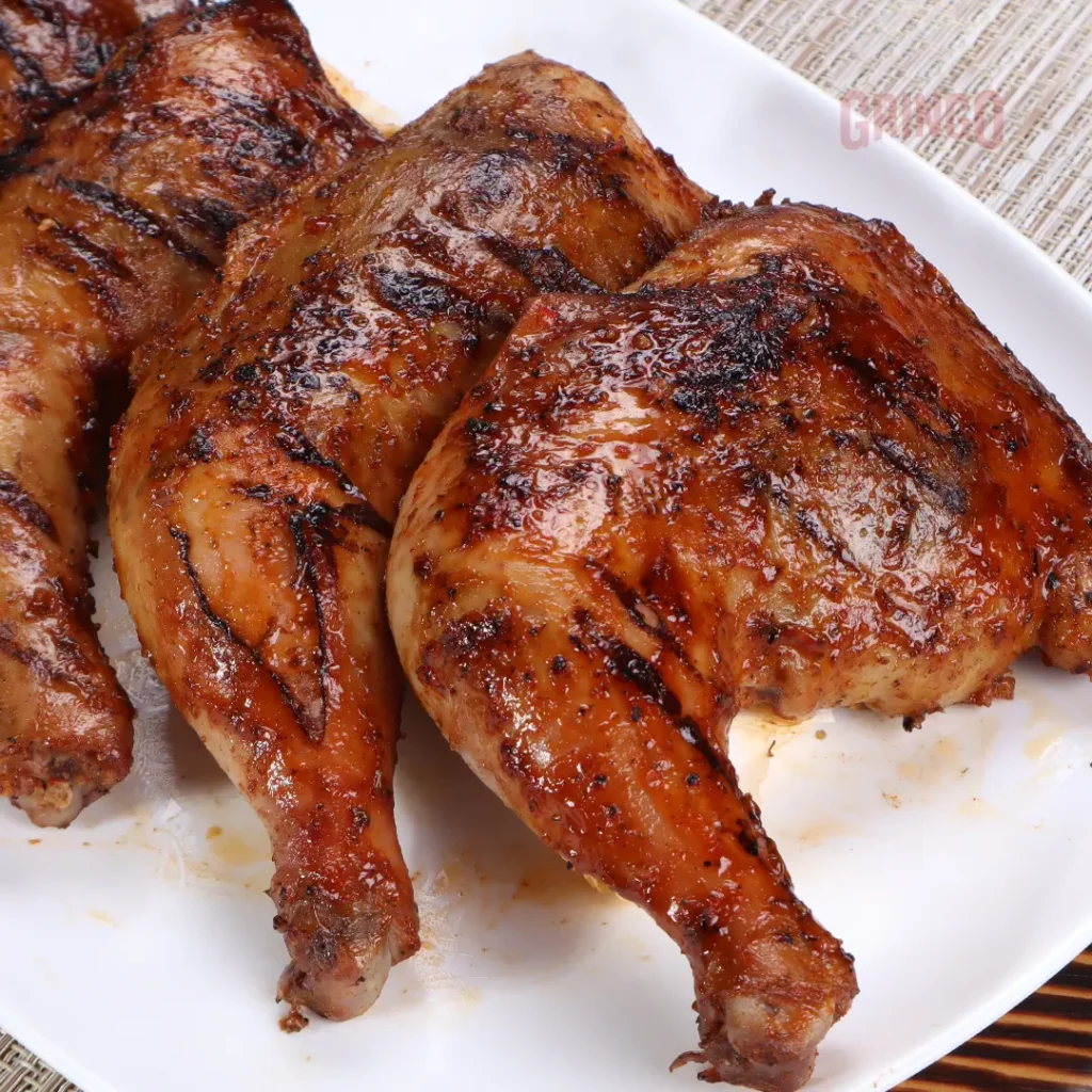 Three pieces of fried chicken, a menu of gringo philippines resturant.